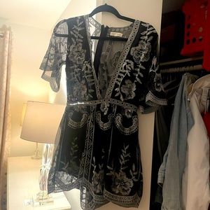 Honey punch black & silver romper with a deep V!